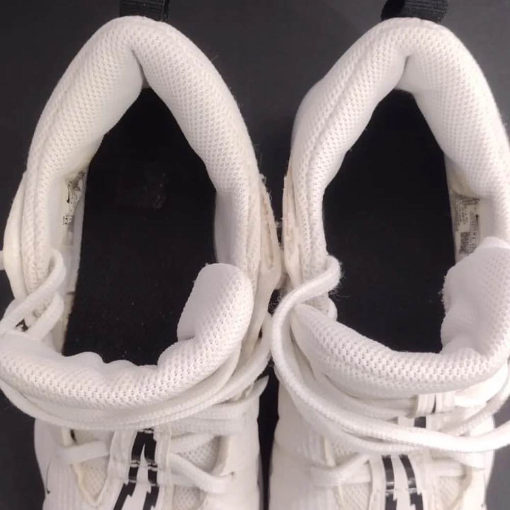 White Athletic Shoes with Black Accents size 13c kids pre owned Exellent cond